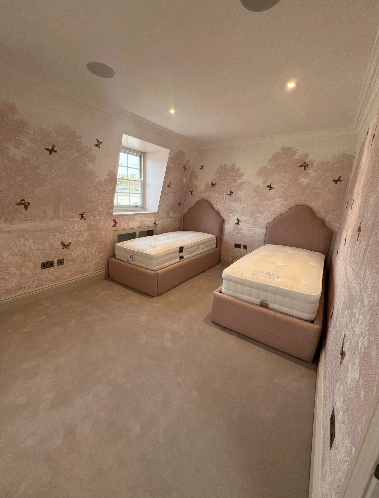Bedroom feature wall hung with delicate floral mural wallpaper