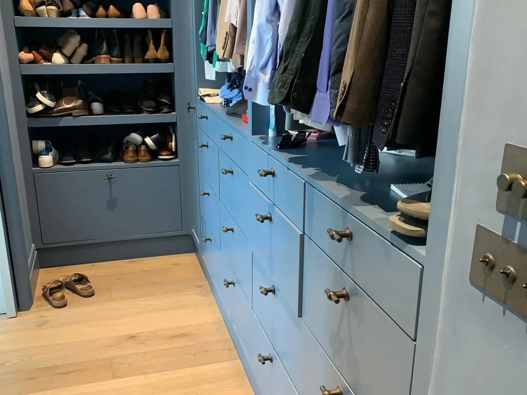 Dressing room shoe and wardrobe joinery painted in blue-grey