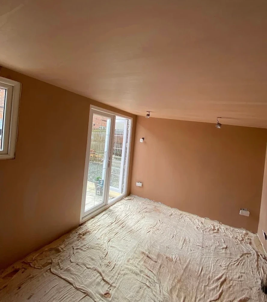 Newly skimmed room with smooth plaster walls before decoration