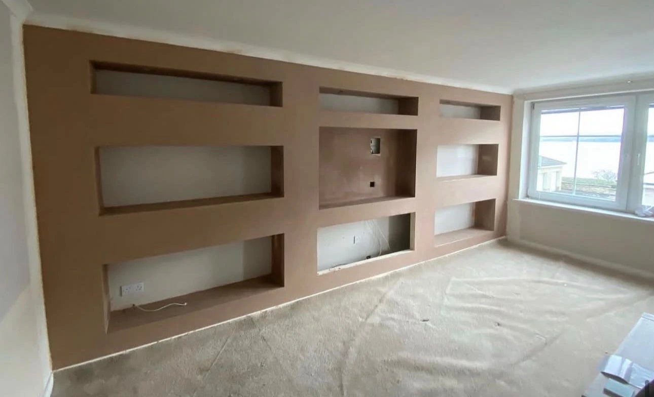 Dry-lined feature wall with recessed shelves ready for decoration
