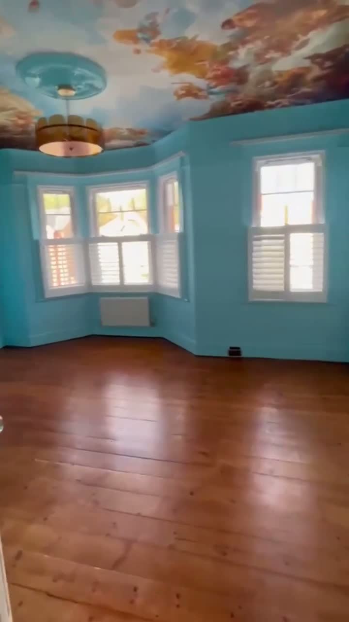 Completed blue room with mural wallpaper ceiling